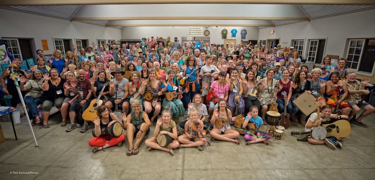 The whole RiverTunes music camp gathered for a group photo, instruments in hand and arms waving
